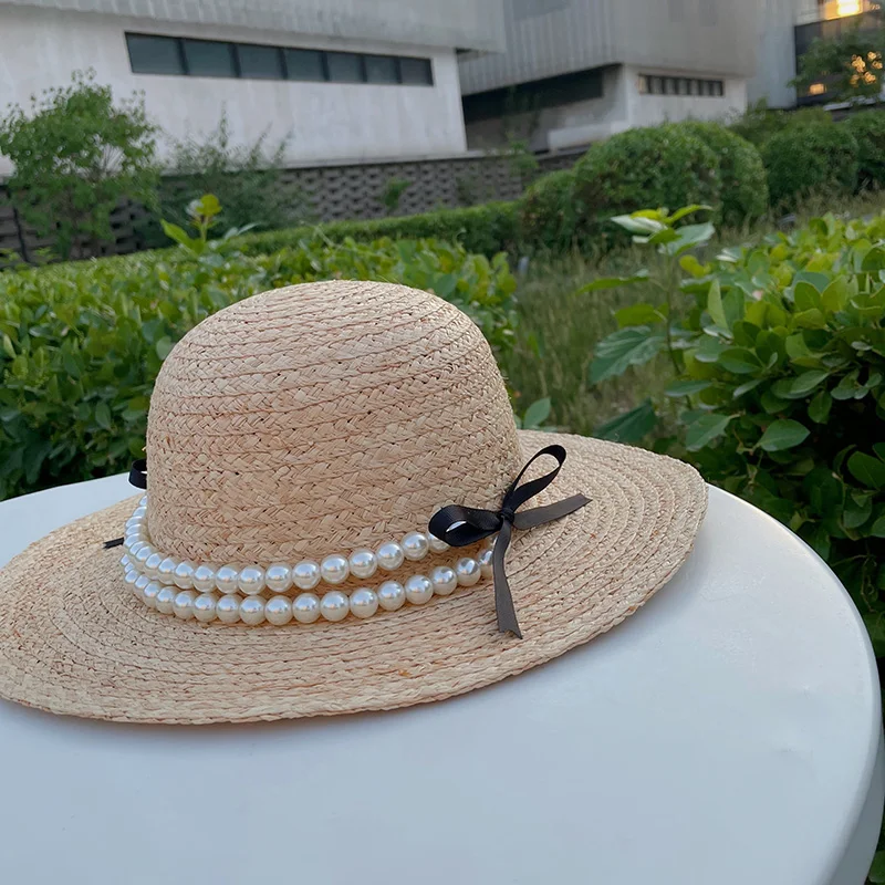 パール付きリボンデザインのラフィア草編みハット：アウトドアで女性に人気の夏用日よけアイテム