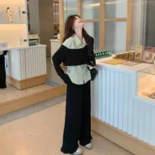 個性的なストライプシャツとワイドパンツのコーディネート（セットアップ対応）