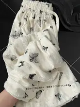 リボンデザインの蝶柄プリント ワイドレッグパンツ【ハイウエスト・ゆったりフィット・大きいサイズ対応】（セットアップ対応）