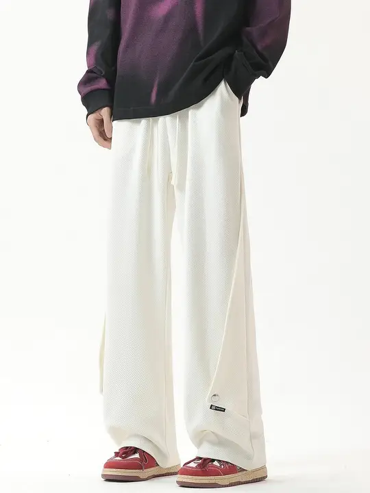 不規則な隠しボタンデザイン ワッフル生地カジュアルパンツ【男性用・フィット】
