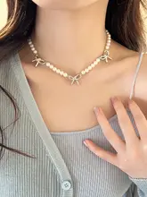 気品あるデザイン！パール付きリボンネックレス【シルバー・鎖骨チェーン】