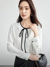 フリルヘムデザインのリボン付きラウンドネックシャツ【ブルー・流れるようなシルエット・ゆったりシフォン】