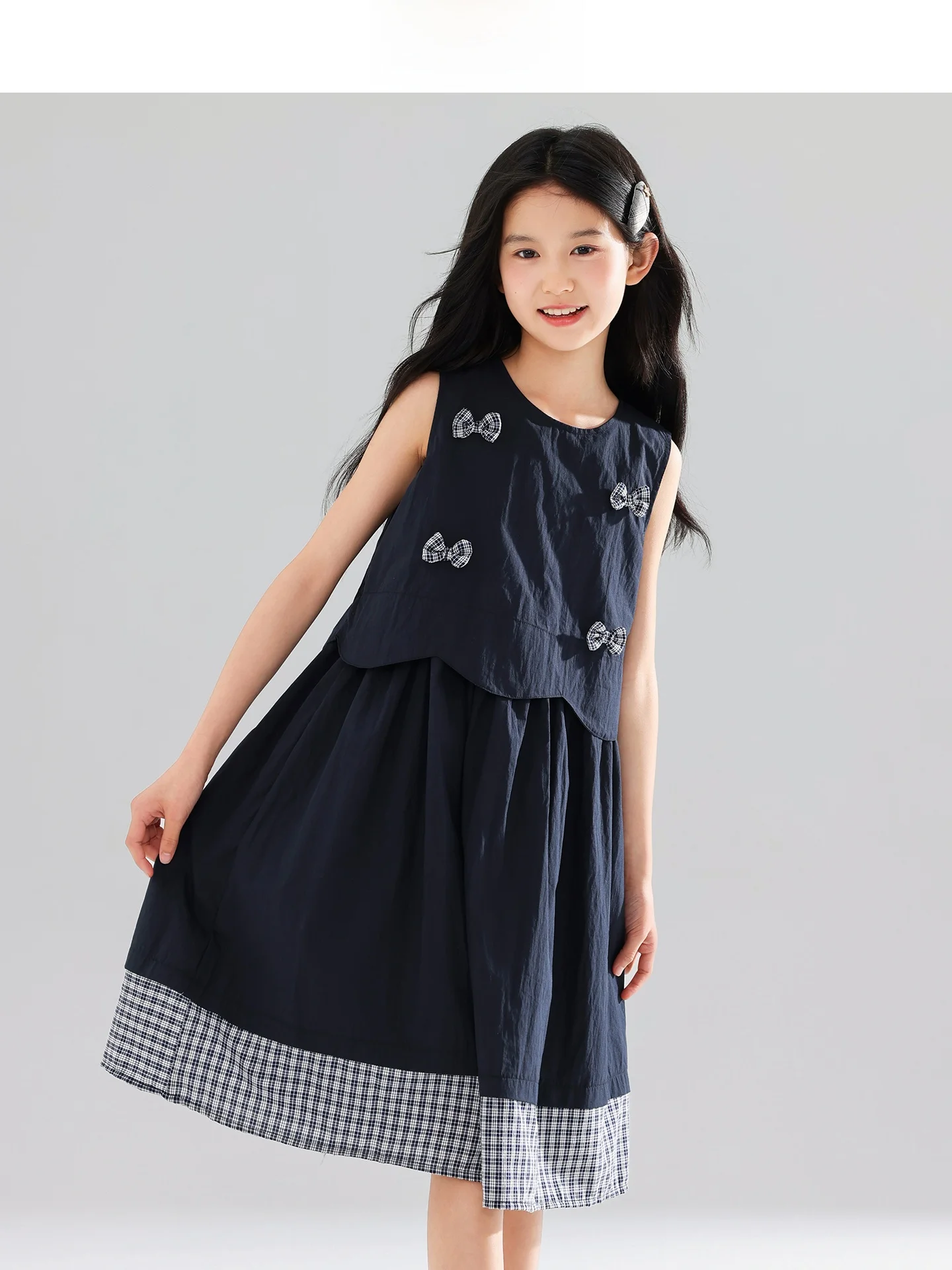 小学6年生の女の子に合う大人っぽいコーデとしての学院風リボン付きチェック柄中長丈ドレス