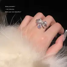 Joy 蝶結びデザインの水滴型リング【立体ラメ・軽やかで華やか】