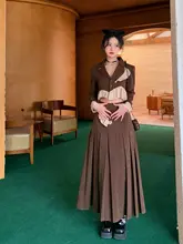 [WALKINDARK] 不規則な切り替えデザインのショートジャケットとボタン付きプリーツロングスカートのセット