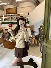 冬の優雅さを演出するバタフライノットケープニットトップ【韓国風・極上の柔らかさ・2点セットアップ対応】