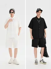 シンプルな無地の肌理タッチのメンズカジュアルポロシャツとショートパンツ（セットアップ対応）