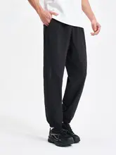 Xtep 束脚デザインの黒いトレーニングパンツ 【春秋用・ストレッチ素材】