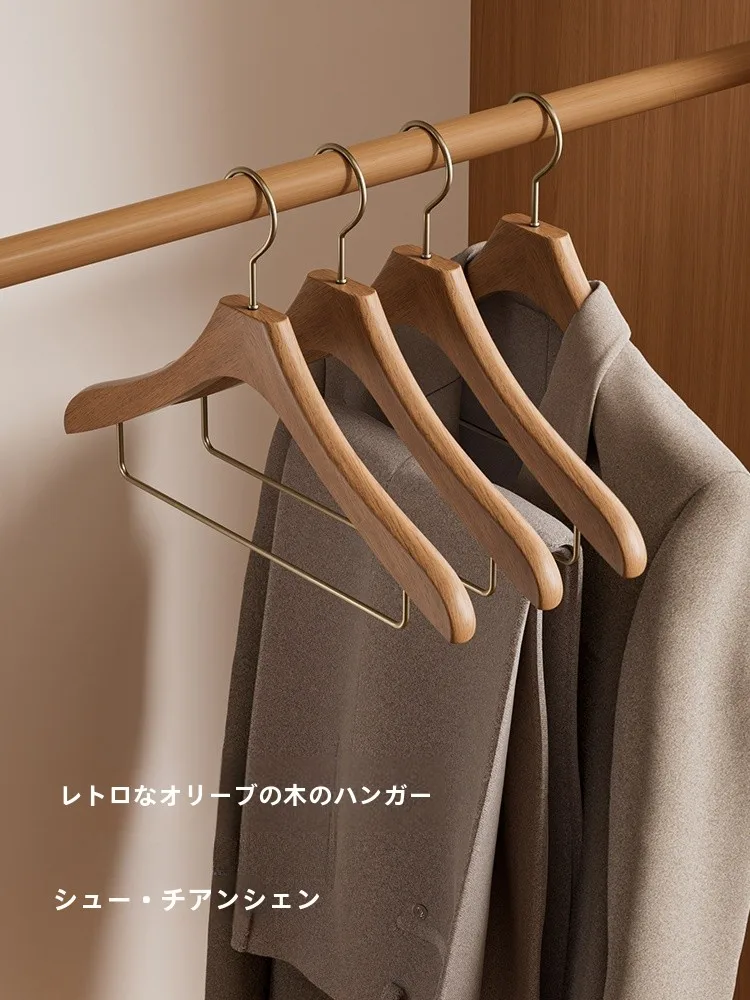 スリムハンガーラックの実用性：無痕設計の高級実木ハンガーが解決する収納課題