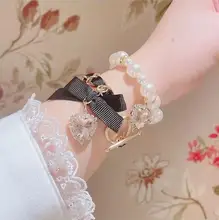 可愛い二重リボンデザインのパールビーズブレスレット【水晶装飾・女の子向け】