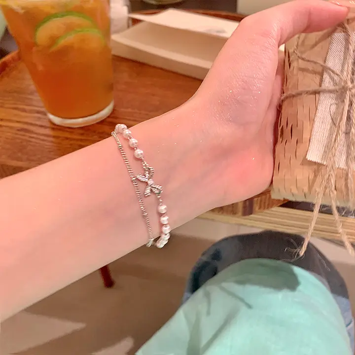 重ね付けできるパールリボンブレスレット【上品・学生向け・ギフトに最適】
