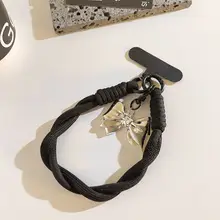 銀色のリボンデザイン携帯電話ストラップ【ブラックボタン・短め・スマホ用・韓国風・便利なアクセサリー】（セットアップ対応）