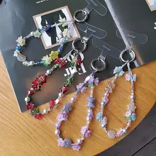 個性的なスズランの花デザインのスマホストラップ【高級感あるビーズ付き・女性向け・防止用】