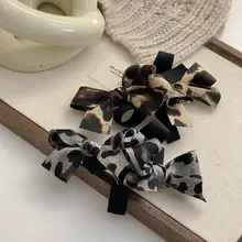 FUNCOCO リボン付き豹柄ヘアクリップ【スプリングクリップ・ポニーテール用】