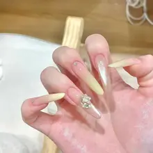 猫目デザインの美しいロングネイル【クリーミイイエロー・手作り・華やかな雰囲気】