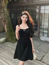 セクシーなバックオープンデザインの黒ワンピース【ピンクリボン付き・小柄向け】