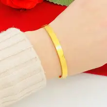 コインデザインのハードブレスレット【金色仕上げ・暗いバックル・四叶草モチーフ・流星雨デザイン】