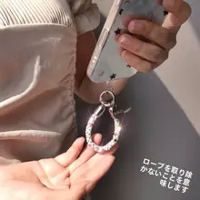 ミニスワロフスキー付きスマホストラップ【高級感のあるデザイン・指輪型短掛け・防盗・精緻な飾り】