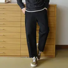 黒の九分丈カジュアルパンツ【裏起毛・ゆったりフィット・ taperedシルエット】（セットアップ対応）