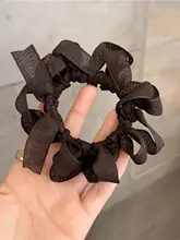 ハンドメイドの蝶結びヘアゴム【デザイナー作品・編み込み】【大人可愛い】
