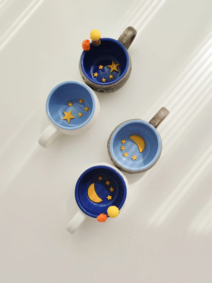 北欧風浮彫りマグカップ：星球モチーフの手作り陶器が提供する個性と機能