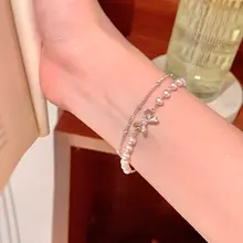 重ね付けできるパールリボンブレスレット【上品・学生向け・ギフトに最適】