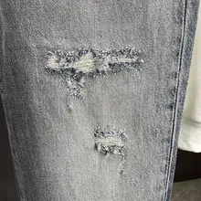 グレーのビンテージ風ダメージデニムパンツ【メンズ・ルーズフィット・秋用】
