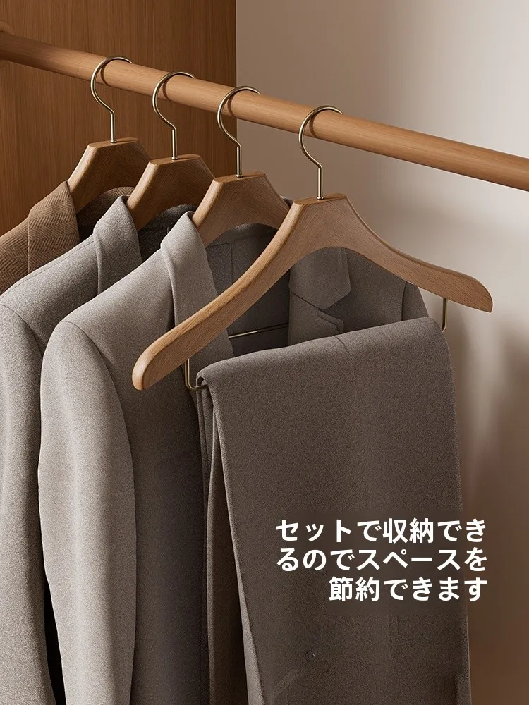 スリムハンガーラックの実用性：無痕設計の高級実木ハンガーが解決する収納課題
