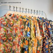 リゾート風フルーツオレンジプリントの短袖シャツ【ユニセックス・ルーズフィット・夏用】