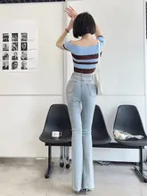 ハイウエストデニムパンツ【伸縮性・フリンジ仕上げ・浅いブルー・微フレア】