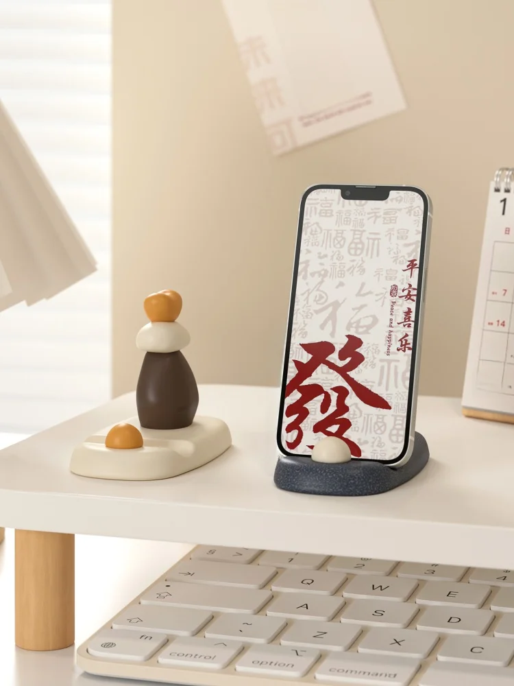 海貝デザインのスマートフォンスタンド：小众アートと日常送礼の融合