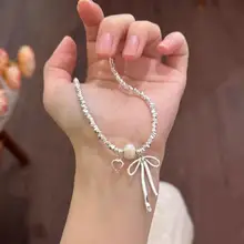 美しいリボンデザインのパールネックレス【鎖骨チェーン・春夏用・高級感あり】