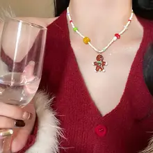 クリスマスツリーとジンジャーブレッドマンのネックレス【秋冬用・女性用・デコレーションデザイン】