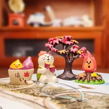 焼き芋を持つ可愛い猫の置物【鈴付き・車載装飾用】