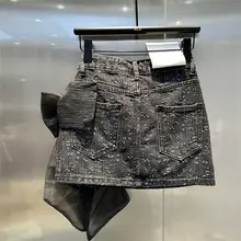 立体的な大きなリボンデザインのデニムミニスカート【メッシュ生地・フィットスタイル】（セットアップ対応）
