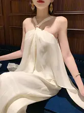 星海老钱風の光沢感ある不規則なハーフネックトップスとワイドパンツ（セットアップ対応）