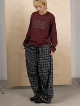 クラシックな黒白チェック柄のウエストゴム男女兼用ワイドパンツ