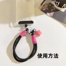可愛いカートゥーンデザインの星型モバイルケース用チャーム【極上の柔らかさ・黒い手首ベルト・短編み込み・多機能キーリング・カメラアクセサリー・女性向け】
