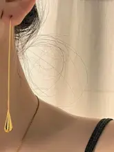 シンプルなデザインの金色水滴イヤリング【長揺れタッセル・女性用】