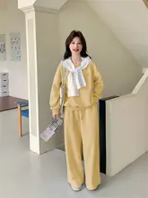 バイカラーストライプ刺繍スウェットシャツとフレアパンツのセットアップ（セットアップ対応）