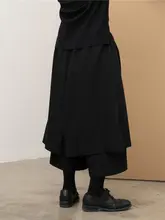 不規則な多層デザインの九分丈ワイドパンツスカート