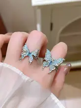 ブルー液体蝶モチーフリング【個性的なデザイン・大ぶり・不規則型】