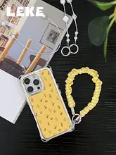 柔らかなイエローの花柄iPhone用ケース【ストラップ付き・斜め掛け対応・レザー製・四隅開孔】