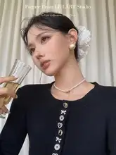 韓国風デザインのボタン列ファッショナブルカーディガン