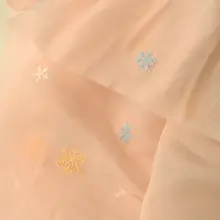 淡い杏色と粉色の雪花模様ポリエステル生地【ドレス用・長袖・ガーゼ風】