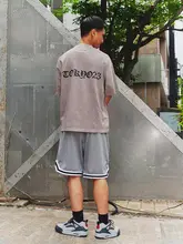 水洗染色の復古風街頭スタイル・背面ロゴ入りショートスリーブTシャツ