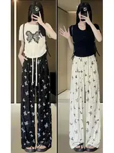 リボンデザインの蝶柄プリント ワイドレッグパンツ【ハイウエスト・ゆったりフィット・大きいサイズ対応】（セットアップ対応）