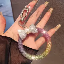 蝶結びデザインのスマホストラップ【高級感ある水晶装飾・キーリング付き・アウトドア用】（セットアップ対応）