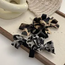 FUNCOCO リボン付き豹柄ヘアクリップ【スプリングクリップ・ポニーテール用】