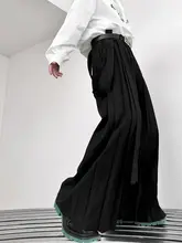 暗黒系デザインのリボン付きカジュアルパンツ【プリーツスカート風・ルーズフィット・スタイリッシュ】（セットアップ対応）